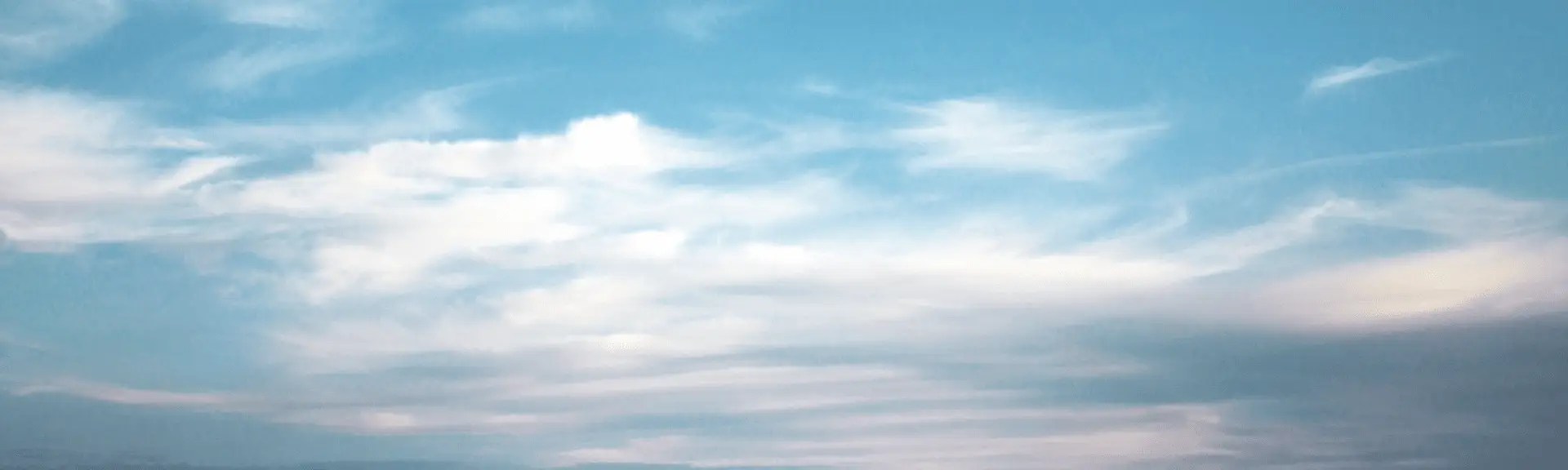 brant blue sky with scattered clouds, showcasing the beauty of New Zealand's weather.